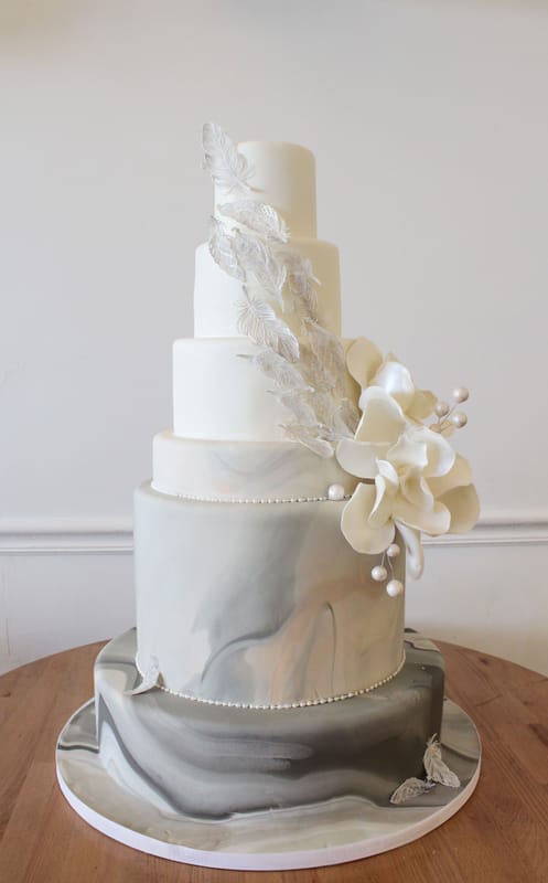 Marbled fondant wedding cake with sugar flowers
