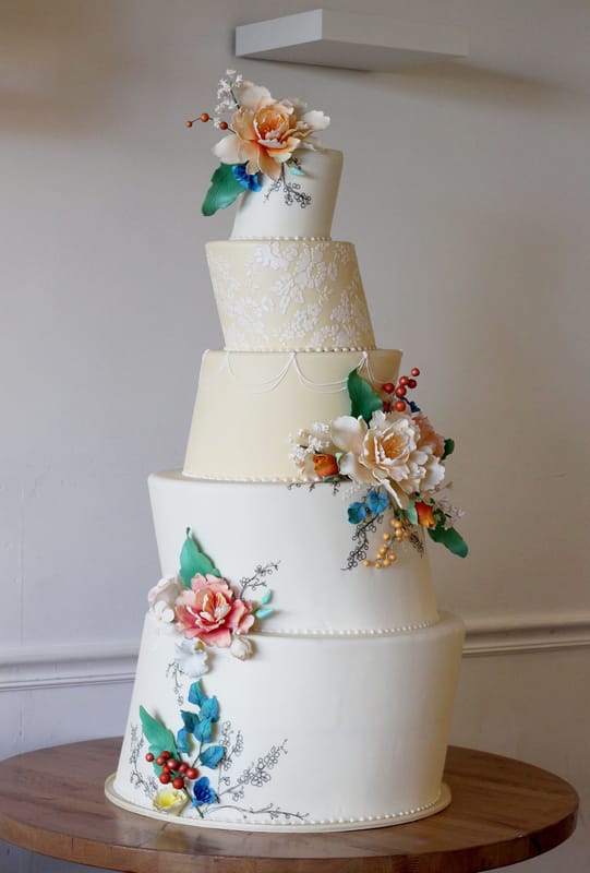 Hand painted wedding cake with sugar flower bouquets