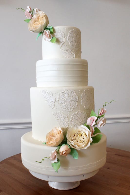 Edible sugar lace wedding cake with sugar flower bouquets