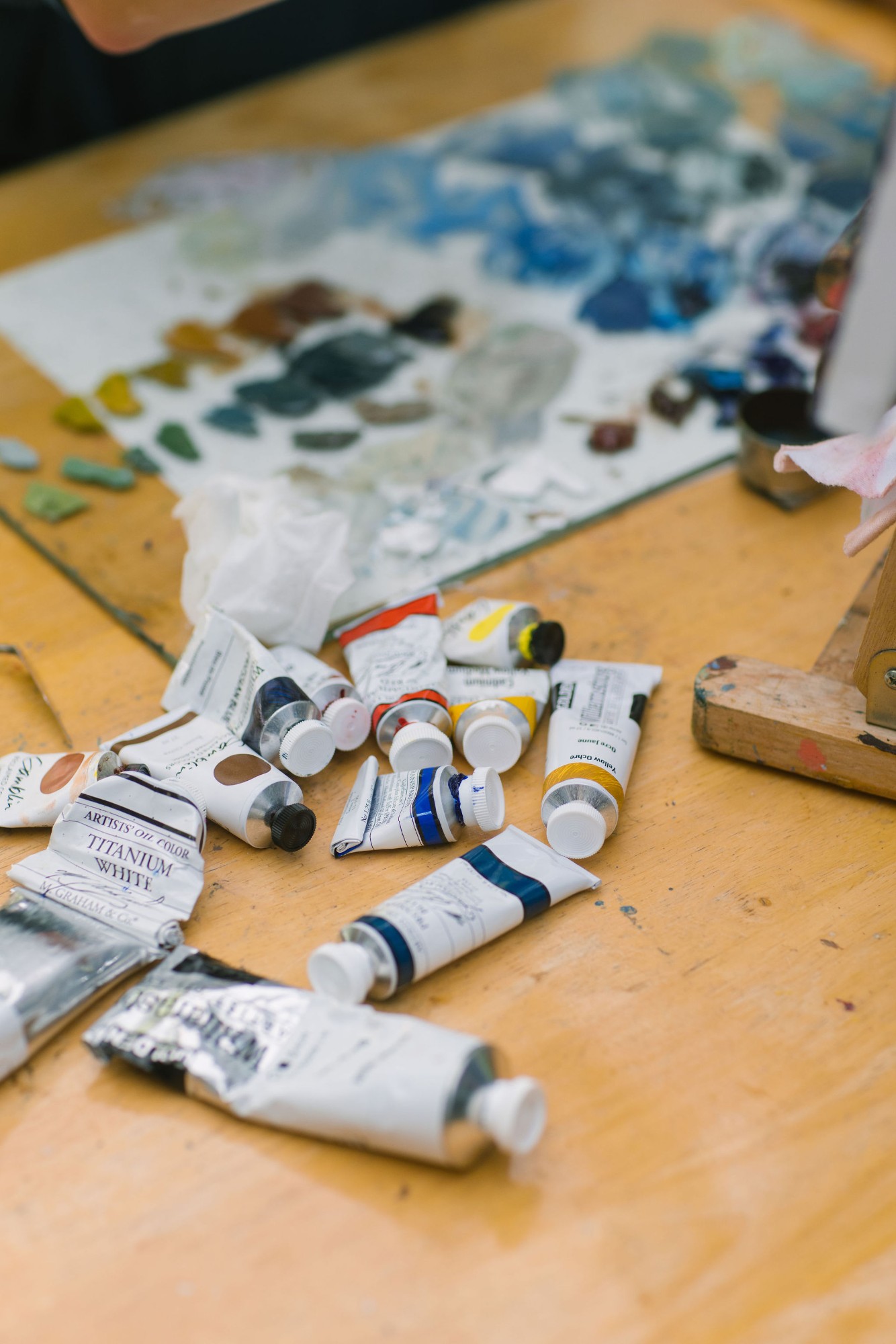 Oil paints and a palette on the studio table